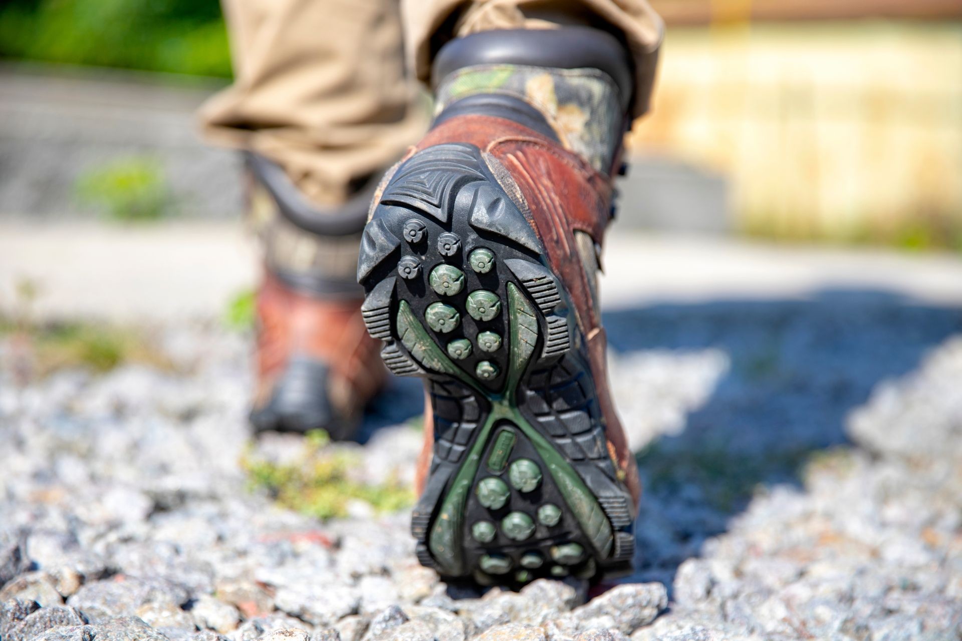 Close up of man's boots while hiking on trail in the mountains. Close up of man's boots while hiking on trail in the mountains.